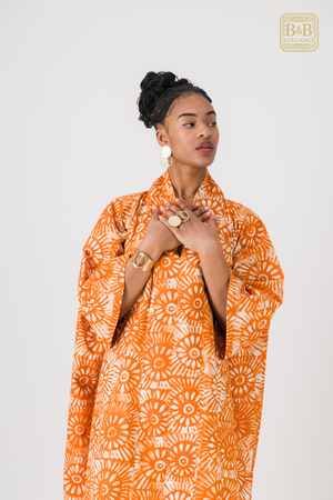 Robe africaine ankara orange motif floral fait main Sénégal - tenue femme cérémonie